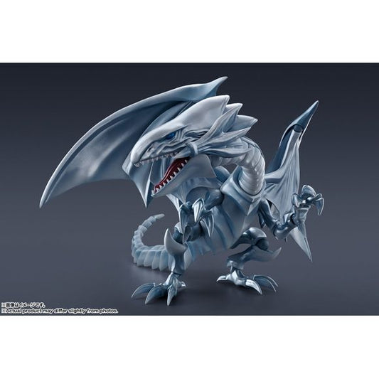 The legendary Blue Eyes White Dragon from "Yu-Gi-Oh! Duel Monsters" joins the "S.H. MonsterArts" action-figure series from Bandai! This beautiful beast is carefully sculpted and meticulously detailed after thorough research of character materials. The proven mobile technology of the S.H.MonsterArts series allows for lots of dynamic poses, down to its defense display when it shrouds itself with its wings! It comes with a set of powerful Destructive Explosive Gale effect parts, and an exclusively designed bas