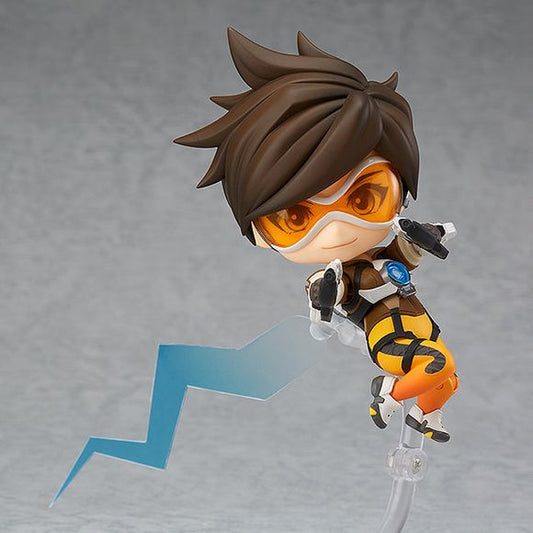 From the globally popular multiplayer first-person shooter 'Overwatch' comes a Nendoroid of Tracer! The Nendoroid comes complete with a variety of optional parts to add effects for her abilities, interchangeable bent legs, and hair options that can cover up her eyes to recreate her iconic poses from the game!

Also included are Tracer's trademark pulse pistols, along with open hand parts to pose her as without her guns, like when she activates her recall ability. Equip her pulse bomb to pose Tracer activa