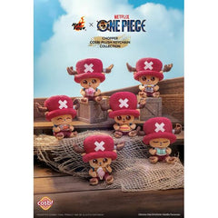 Set sail with the adorable Tony Tony Chopper in this Hot Toys x Netflix One Piece Cosbi Plush Keychain Collection! Inspired by the hit Netflix live-action adaptation of One Piece, this charming collectible series features Chopper in a variety of cute poses and themed outfits, reimagined as soft plush-style mini keychains.

Each design captures Chopper’s lovable personality with detailed embroidery, soft textures, and expressive styling that fans of the Straw Hat crew will instantly recognize. Compact and ea