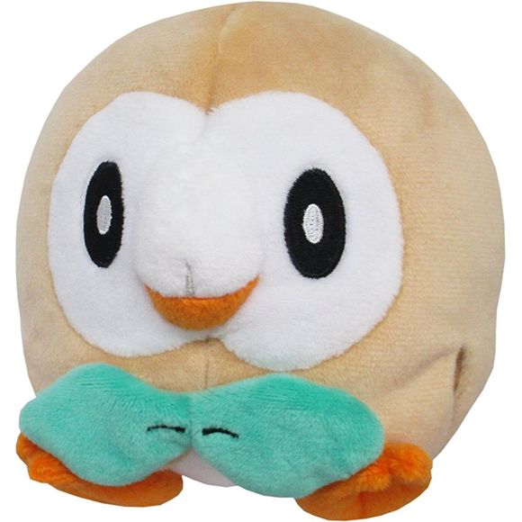 Rowlet is a small, avian Pokémon resembling a young owl. It has a round body and two short legs. It is primarily brown with a white underside and facial disc. It has large black eyes and stubby beak. The top part of its beak is white, while the lower half is an orange-brown. Its feet have two forward-facing toes and one backward facing toe; they are the same color as the lower half of its beak. Two leaves sprout form its chest, arranged so that they resemble a bowtie. Additional leaves line the undersides o