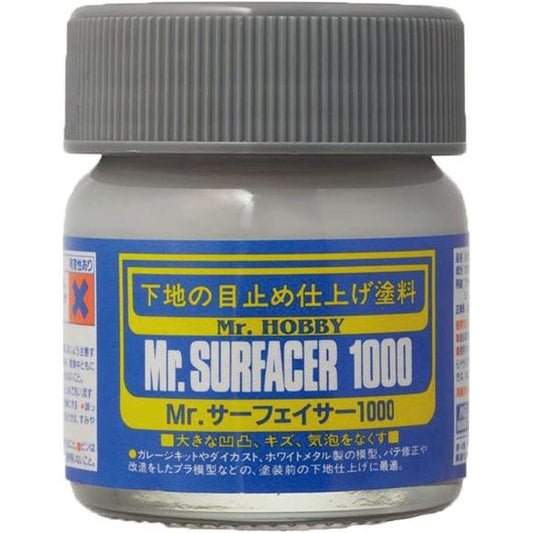 Mr.SURFACER 1000 contains finer granules than Mr.SURFACER 500. They are both used in much the same way but due to the finer granules after sanding with waterproof sand-paper, a perfectly corrected surface is possible. Available in bottle and spray. Provides neutral color background and prepares surface for paint application. 40ml.  Shipping in continental US only, ground shipping only - no expedited service.