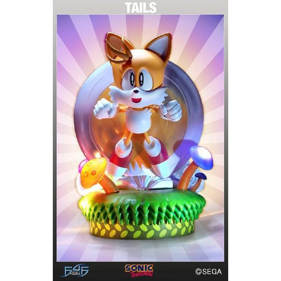 This is in NEW and UNOPENED Condition.

First 4 Figures is proud to present Tails! Created in his classic design, he is zooming along Mushroom Hill Zone, with his twin tails spinning at full speed creating a wind behind him! We painstakingly added all his details and created a dynamic pose and expression that complements his personality. He is 12 inches tall - fitting perfectly in scale with the others in the series.

This is the exclusive version of Tails. There are three mushrooms on the base that slowly