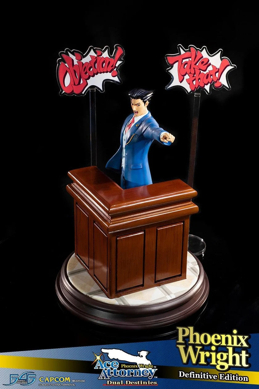 This statue has no edition number, and was a replacement and is in new and unopened condition. Phoenix Wright: Ace Attorney - Dual Destinies - Phoenix Wright DEFINITIVE edition comes with the following:- 

Phoenix Wright: Ace Attorney - Dual Destinies - Phoenix Wright RESIN statue
Highly detailed base capturing the theme and style from the courtroom in Phoenix Wright: Ace Attorney - Dual Destinies
Additional large base featuring the defense bench
TWO acrylic speech bubbles, "OBJECTION!" and "TAKE THAT!" fro