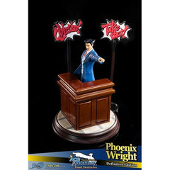 This statue has no edition number, and was a replacement and is in new and unopened condition. Phoenix Wright: Ace Attorney - Dual Destinies - Phoenix Wright DEFINITIVE edition comes with the following:- 

Phoenix Wright: Ace Attorney - Dual Destinies - Phoenix Wright RESIN statue
Highly detailed base capturing the theme and style from the courtroom in Phoenix Wright: Ace Attorney - Dual Destinies
Additional large base featuring the defense bench
TWO acrylic speech bubbles, "OBJECTION!" and "TAKE THAT!" fro