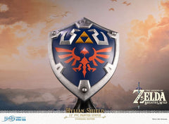 First 4 Figures is proud to introduce their latest PVC collectible, the Hylian Shield Standard Edition from The Legend of Zelda: Breath of the Wild.

The blue front with silver borders, the Triforce symbol, and Hyrule's crest are staples in its classic design, and this particular statue was inspired by the design from The Legend of Zelda: Breath of the Wild.

As for the base it's mounted on, the Hylian Shield attaches magnetically to the display stand it comes with, which is simple by design but perfectly a