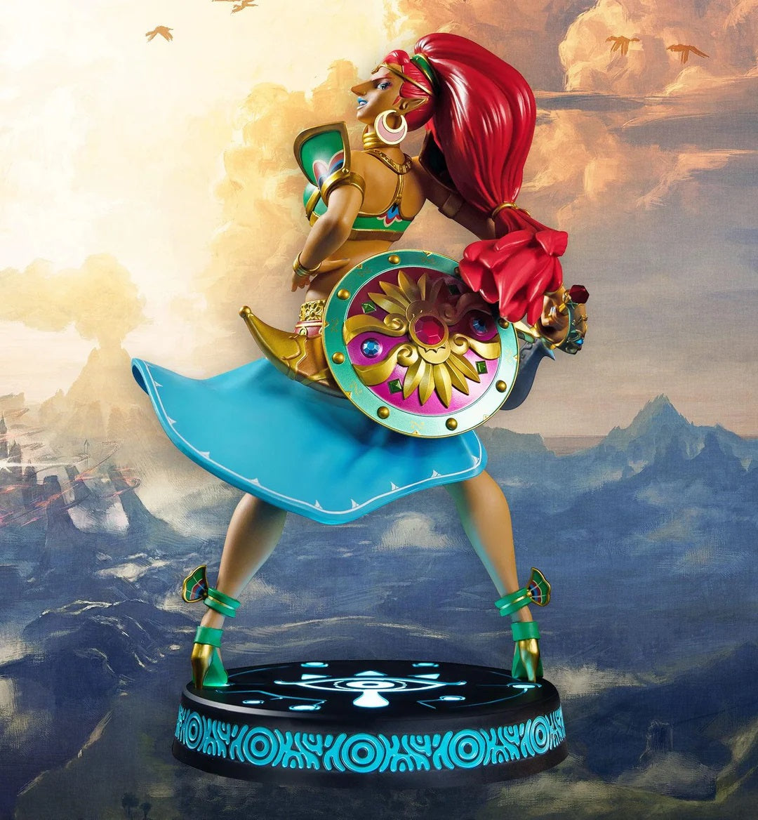 This statue has no edition number, and was a replacement and is in new and unopened condition. 

First 4 Figures proudly presents Gerudo Champion and pilot of the Divine Beast Vah Naboris: Urbosa Exclusive Edition! She is brought to life with stunning detail in this high-quality PVC statue. Her dynamic pose makes her appear in mid-twirl, with her skirt and hair flowing free. The base’s design features the Sheikah Eye symbol, consistent with the other statues in the First 4 Figures The Legend of Zelda: Breat