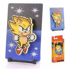 Sonic’s powered-up form using the Chaos Emeralds, granting him incredible speed and invincibility.

FiGGYZ are Pop Magnet Collectibles - pixel-art characters that snap magnetically onto display-ready backdrops.

Each one features:

A reversible metal display
Side A: Themed background related to the character
Side B: Classic Background, typically of the franchise
A magnetized figure raised off the surface using MagMounts™ for a 3D pop out feeling
Comes with a display base for shelves and a magnetic sticker f