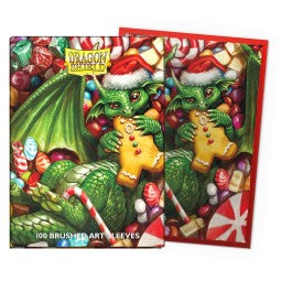 The 2024 Dragon Shield Christmas Brushed Art sleeves feature mischevious dragons endulging in seasonal sweets.
Dragon Shield Standard Art Sleeves are printed directly on the sleeve and do not peel or split. Brushed Art Sleeves have a lightly textured back giving them a silky smooth shuffle feel. No white borders, full art or colored frames.
The sturdy cardboard box fits 75+ single sleeved cards or 65+ double sleeved cards measuring up to 63 x 88 mms (2.5 x 3.5"), for games like MTG, Pokemon, Flesh and Blood