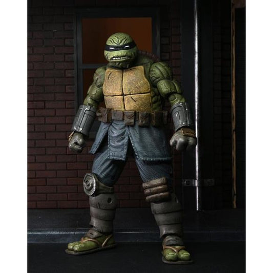 From the 2020 Teenage Mutant Ninja Turtles comic book series, The Last Ronin! In a future NYC far different than the one we know today, a lone surviving Turtle goes on a seemingly hopeless mission to obtain justice for his fallen family and friends. This unarmored version of The Last Ronin action figure is authentic to the comic book depiction and stands in 7” scale. Includes Mouser, tonfa, ninja star, throwing knives, Splinter’s journal, nunchucks, broken sword, and interchangeable head and hands. Comes in