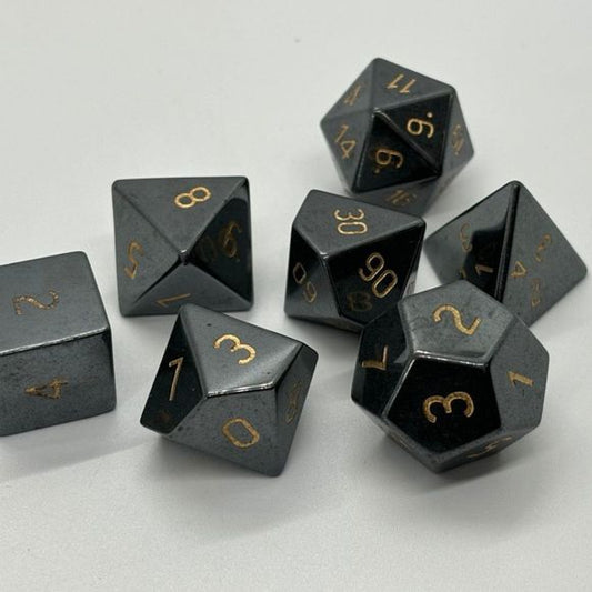 The perfect companion for your gaming needs! These premium, high-end cut stone polyhedral dice are exactly what you've been searching for that upcoming game night with the group. Each set weighs roughly 8 ounces and are stored in a quality, brushed metal tin with foam insert. These dice are a rich quality stone with nice weight to them and engraved each with crisp, easy-to-read numerals. Many styles and colors are available.

This set includes on of each: d20, d12, d10, d10 (percentile), d8, d6, and a d4