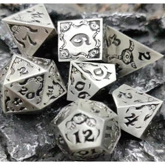 The perfect companion for your gaming needs! These premium die-cast polyhedral dice are exactly what you've been searching for that upcoming game night with the group. Stored in a quality, brushed metal tin with foam insert. These dice are a rich metal with nice weight to them and engraved each with crisp, easy-to-read numerals. Many styles and colors are available.

This set includes one of each: d20, d12, d10, d10 (percentile), d8, d6, and a d4 (7 dice in total). All inside the Galactic Toys Dice Tin.