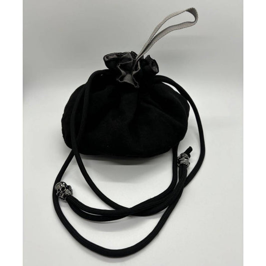 Enjoy this Soft to the touch dice bag in black! It hold over 100 dice of different shapes and sizes. Comes with 8 compartments to keep all of your dice organized! The drawstrings are finished with silver skulls