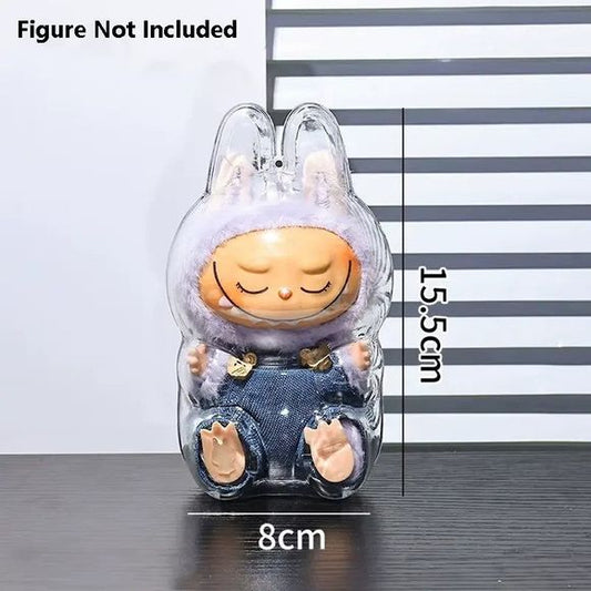 Keep your Labubu plush safe and looking adorable wherever you go with this crystal-clear protective shell! Designed specifically to fit Labubu figures and plushes, this case is perfect for clipping to backpacks, bags, or display shelves.

Perfect Fit: Shaped to match Labubu’s iconic silhouette, including bunny ears and rounded body.

Durable Protection: Made from sturdy, transparent plastic to shield your plush from dirt, dust, scratches, and light rain.

On-the-Go Ready: Lightweight yet strong—ideal for ha