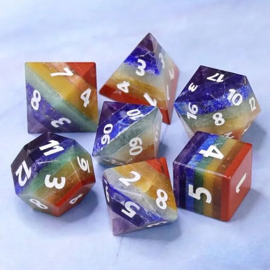 The perfect companion for your gaming needs! These premium, high-end cut stone polyhedral dice are exactly what you've been searching for that upcoming game night with the group. Each set weighs roughly 2.5 ounces and are stored in a quality, brushed metal tin with foam insert. These dice are a rich natural stone with nice weight to them and engraved each with crisp, easy-to-read numerals. Many styles and colors are available. Made of natural gemstone, it includes Aventurine, Aventurine Orange, Lazurite, Bl