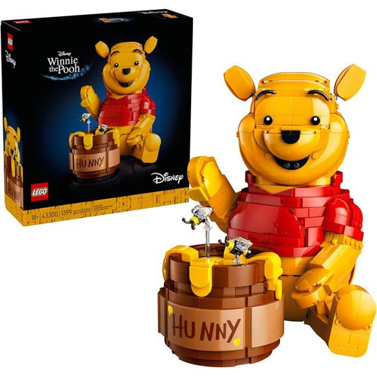 Celebrate 100 years of childhood magic with the LEGO Disney Winnie the Pooh (43300) display model building kit for adults ages 18 and up. This charming commemorative set brings the beloved bear to life with a brick-built, classic Winnie the Pooh character featuring a movable head, ears, arms and hands, plus a buildable honey pot. The brick-built model also holds a delightful surprise: open the 'Hunny' pot to reveal 2 hidden rooms with a Winnie the Pooh minifigure and an Eeyore figure tucked inside. Packed w