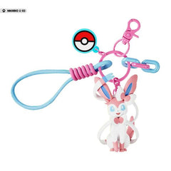Add a touch of Fairy-type elegance to your everyday accessories with this adorable Sylveon Charm Keychain by Langbowang! Featuring Sylveon in a cute chibi-style design, complete with its signature ribbon-like feelers and pastel pink-and-blue color palette, this charming accessory is perfect for Pokémon fans who love one of the most beloved Eeveelutions.

The keychain includes a detailed Sylveon figure, a Poké Ball charm, colorful decorative links, and a convenient wrist loop attachment for easy carrying. Wh