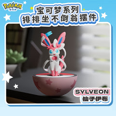 Add a touch of Fairy-type charm to your collection with this adorable Sylveon Wobble Balance Figure from Langbowang! Featuring the beloved Evolution Pokémon perched atop a colorful Poké Ball-inspired base, this collectible figure is designed with a self-righting wobble mechanism that gently rocks and returns upright when nudged.

With Sylveon's signature ribbons, bows, and pastel color palette faithfully recreated in a cute stylized design, this desktop collectible makes a delightful display piece for Pokém