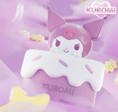 Add a sweet touch of Sanrio charm to your collection with the Holly Box Sanrio Characters Cake Slice Storage Box Figure featuring Kuromi! Designed to look like a delicious slice of frosted cake, this adorable collectible combines cute character display with functional storage.

Kuromi peeks over the top of her pastel cake slice storage box, complete with decorative frosting details and dessert-inspired accents. The storage compartment is perfect for holding small accessories, jewelry, desk items, or other t