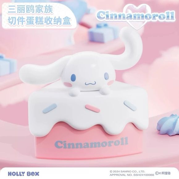 Add a touch of sweetness to your space with the Cinnamoroll Cake Slice Storage Box from Holly Box! This adorable collectible combines cute Sanrio styling with practical storage, featuring Cinnamoroll relaxing atop a pastel cake slice decorated with colorful frosting and candy sprinkles.

Lift the top to reveal a hidden storage compartment perfect for holding small accessories, jewelry, coins, desk essentials, or other tiny treasures. The soft pink and white color palette, paired with Cinnamoroll's lovable e