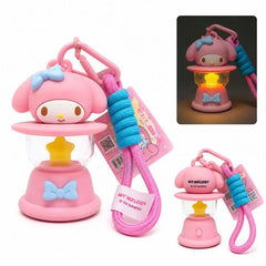 Add a touch of sweetness to your everyday accessories with this adorable My Melody Light-Up Lantern Keychain! Featuring the beloved Sanrio character My Melody perched atop a pastel pink lantern, this charming accessory combines cute collectible styling with a functional glowing light.

Inside the lantern is a star-shaped LED that illuminates with a warm glow, making it a fun accent for backpacks, purses, keyrings, or display shelves. The included matching wrist strap and carabiner clip make it easy to attac