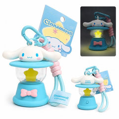 Bring a touch of Sanrio charm wherever you go with this adorable Cinnamoroll Light-Up Lantern Keychain! Designed with Cinnamoroll perched atop a pastel blue lantern, this cute accessory features a glowing star-shaped light inside the lantern chamber. Simply activate the light for a warm, whimsical glow that's perfect for backpacks, purses, keys, or collecting.

The included carabiner clip and matching wrist strap make it easy to attach to your favorite bag, while the compact size makes it a fun everyday com