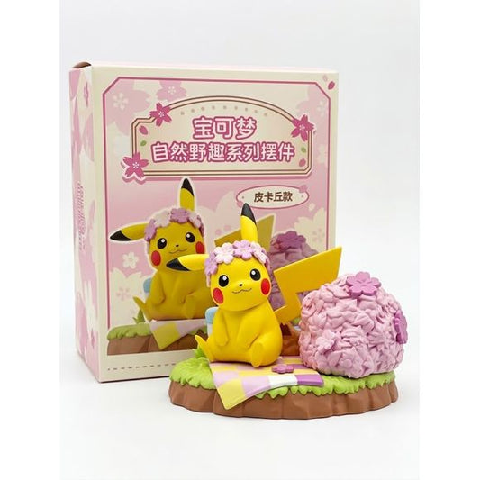 Celebrate the beauty of spring with this charming Pikachu figure from the Pokémon Nature Adventure Series. Featuring Pikachu relaxing beside a blooming cherry blossom tree, this collectible captures a peaceful outdoor scene inspired by nature and seasonal adventures.

With vibrant colors, detailed sculpting, and a decorative display base, this figure brings a relaxing and whimsical atmosphere to any Pokémon collection. The figure can be displayed on the scenic base or removed for standalone display, making