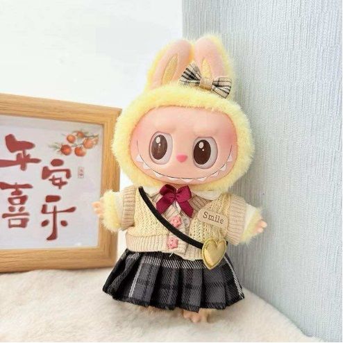 Outfit includes a skirt, blouse, cardigan, bow and sling bag for your favorite Labubu. Customize and accessorize yours today! Labubu not included.