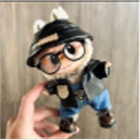 Outfit includes a hat, jacket and overalls perfectly designed to fit your favorite Labubu. Customize and accessorize yours today! Glasses, Shoes and Labubu not included.