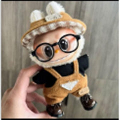 Outfit includes a hat, shirt and overalls perfectly designed to fit your favorite Labubu. Customize and accessorize yours today! Glasses, Shoes and Labubu not included.