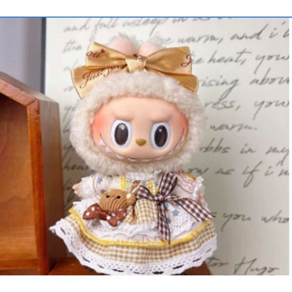 Outfit includes a dress with bear buddy and bow perfectly designed to fit your favorite Labubu. Customize and accessorize yours today! Labubu not included.