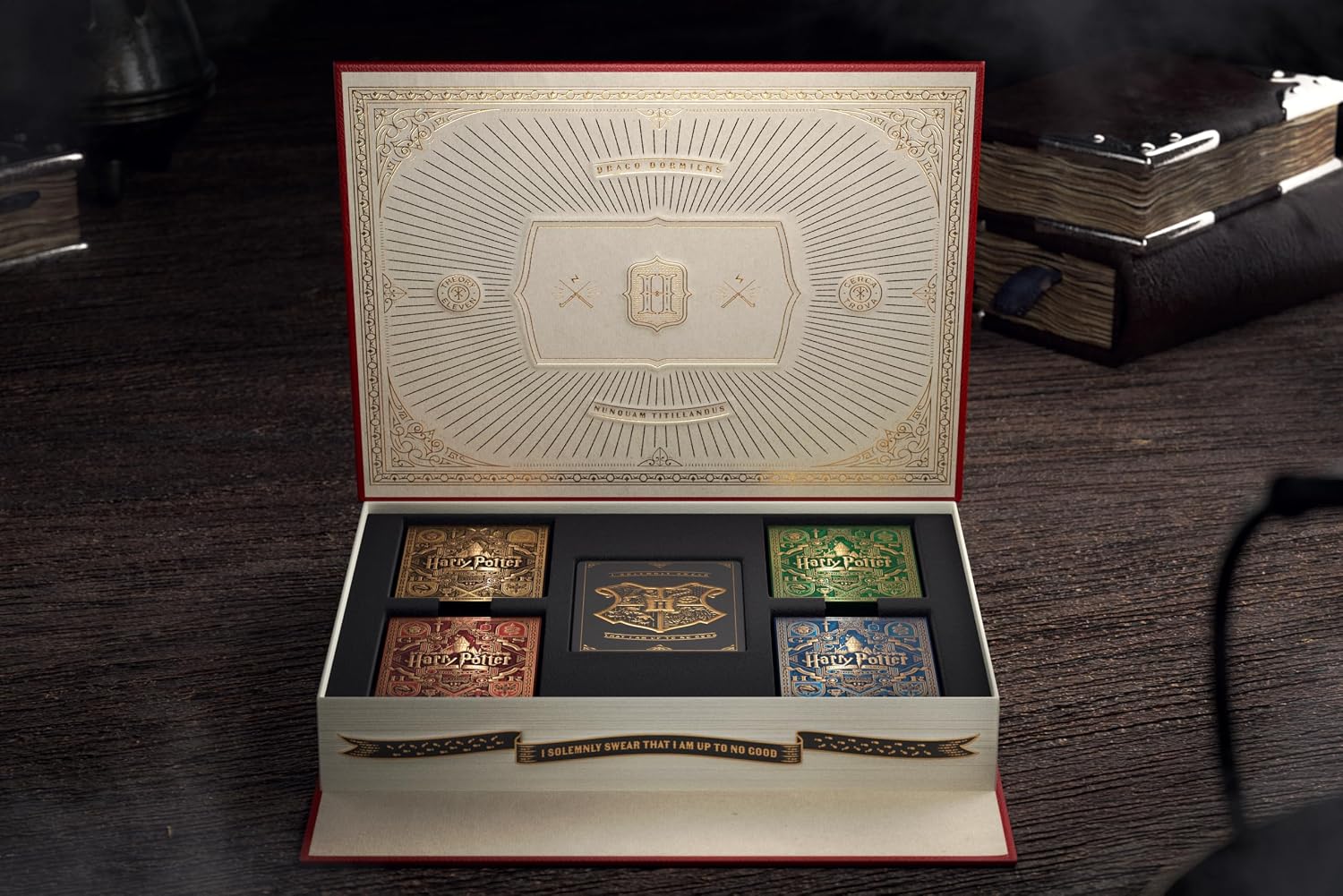 Use your favorite wizarding spell and cause the book to UNLOCK and MOVE by itself, as if by magic!
Inside are five decks of premium Harry Potter Playing Cards, with ornate gold foil and fan-favorite characters like Harry, Hermione, Dumbledore, and more!
Become the next great wizard at Hogwarts! Use spells such Alohomora and Revelio to unlock and reveal secret compartments within.
It looks like magic, but the mechanism works by moving a hidden panel on the bottom of the box. It's easy to learn, and fun to pr