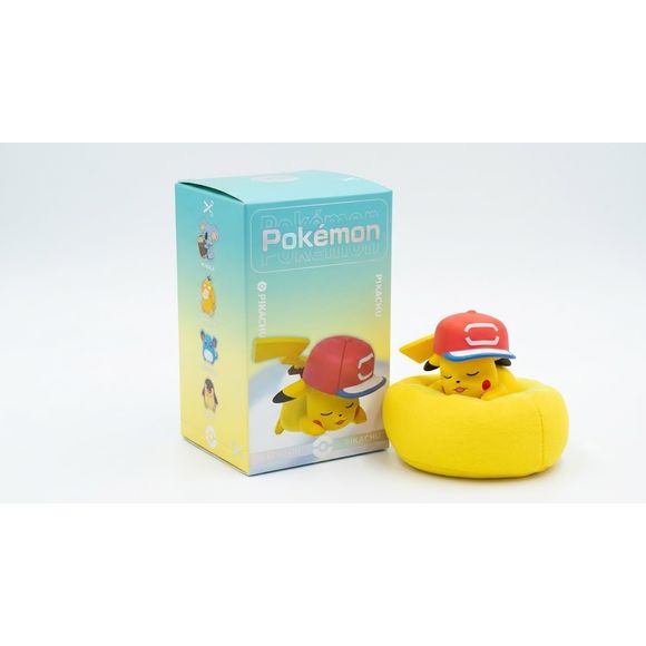 Catch some well-deserved rest with this adorable Pokémon Pikachu Cozy Nap Figure. Featuring Pikachu peacefully sleeping while wearing a trainer-inspired cap and nestled inside a soft cushion-style bed, this charming collectible captures a rare and heartwarming side of everyone's favorite Electric-type Pokémon.

Designed with vibrant colors and a unique plush-inspired display base, this figure blends Pokémon charm with cozy décor aesthetics. The relaxed sleeping pose and detailed sculpt make it a standout pi
