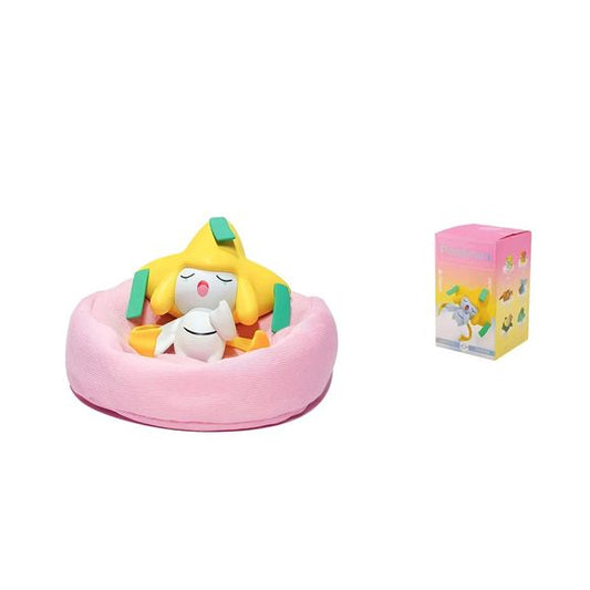 Add a touch of mythical Pokémon magic to your collection with this adorable Jirachi Sleeping Figure! Featuring the Wish Pokémon peacefully resting on a soft pink cushion-style base, this charming collectible captures Jirachi in a relaxing and heartwarming pose that fans are sure to love.

Carefully sculpted with vibrant colors and fine details, this display piece showcases Jirachi's iconic star-shaped head and sleepy expression, making it a standout addition to any Pokémon collection. The cozy cushion-style