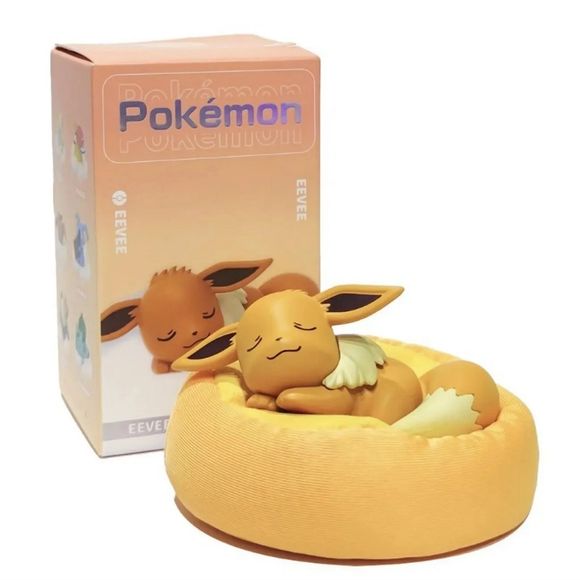 Drift into dreamland with this adorable Sleeping Eevee Figure from Langbowang's popular Pokémon Casual Time Series! Featuring Eevee peacefully curled up in a cozy plush pet bed, this charming collectible captures one of Pokémon's most beloved companions during a well-earned nap.

Beautifully sculpted with closed eyes, relaxed ears, and a curled fluffy tail, Eevee rests comfortably atop a soft cushion-inspired base that adds warmth and personality to the display. The gentle pose and soothing color palette ma
