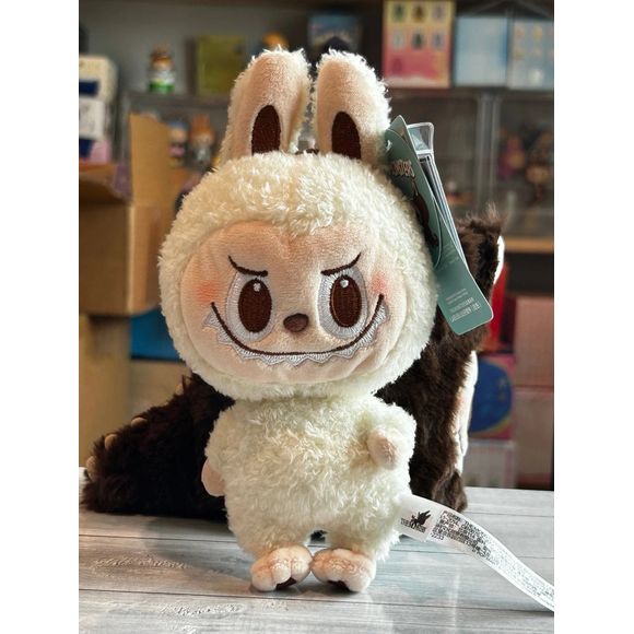 This exclusive plush pendant showcases Labubu in a soft, high-quality plush design with a convenient keychain/bag attachment, making it perfect for decorating backpacks, purses, tote bags, or keys. Whether you're a long-time collector or just discovering the charm of Labubu, this POP LAND exclusive release is a must-have addition to any designer toy lineup.  Authentic.