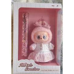Wrap up in warmth and whimsy with the POP MART Labubu The Monsters Mokoko – Fall Into Sweaters collectible vinyl plush pendant!

This adorable Mokoko figure comes dressed in a soft knitted sweater with a matching hood and pink skirt embroidered with delicate details. The cozy “Fall Into Sweaters” design captures the charm of autumn and the cuteness of the Labubu universe. Perfect for collectors and fans of designer vinyl toys, this pendant doubles as a delightful display piece or a stylish accessory.  Authe