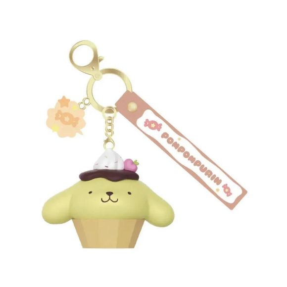 Sweeten up your everyday accessories with the Langbowang Holly Box Sanrio Characters Snack Charm Vinyl Keychain - Pompompurin! This adorable collectible features Pompompurin transformed into a delicious dessert-inspired treat, sitting in a cupcake wrapper and topped with whipped cream, chocolate sauce, and a tiny strawberry accent.

Designed in Pompompurin's signature soft yellow color palette, this charming keychain includes a matching logo strap and a decorative candy charm that perfectly complements the