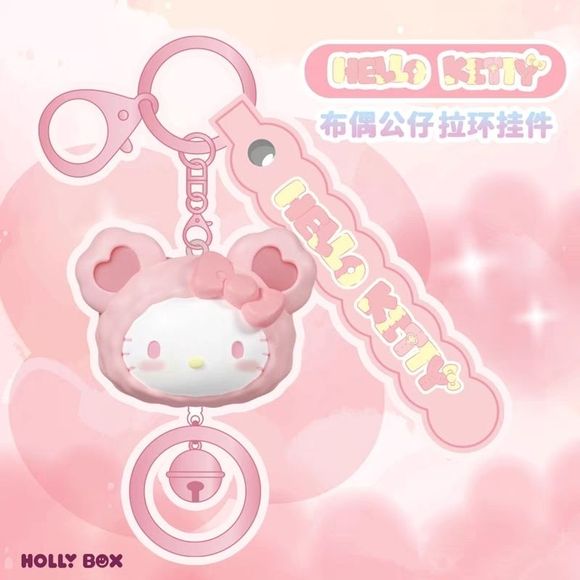 Add a touch of kawaii charm to your everyday essentials with this adorable Hello Kitty Bear Hoodie Keychain from Holly Box! Featuring Hello Kitty dressed in a cute pink bear-eared hoodie, this stylish accessory combines sweet pastel colors with playful details that Sanrio fans will love.

The keychain includes a matching "HELLO KITTY" charm tag, a sturdy metal key ring, and a decorative dangling bell accent that adds extra personality to the design. Lightweight yet eye-catching, it's perfect for attaching t