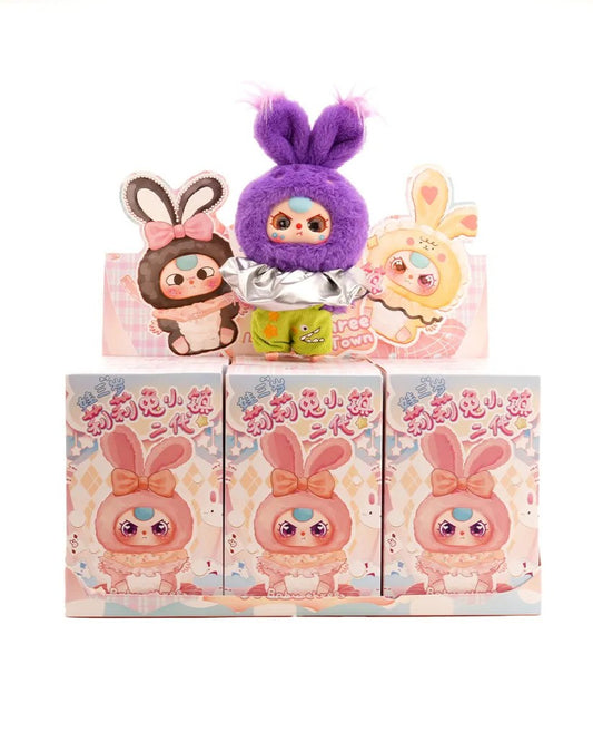 Bring a hop of joy to your collection with the Baby Three Lily Rabbit Town V2 Plush Blind Box! This whimsical series invites you into a rabbit-inspired wonderland where every plush has its own charm, story, and style. Each blind box holds one of 12 possible figures — 11 regular ones plus a rare secret edition — making each unboxing an adventure full of possibility.

Crafted with soft plush materials, vivid pastel palettes, and charming rabbit-town design elements, these characters are as perfect for display