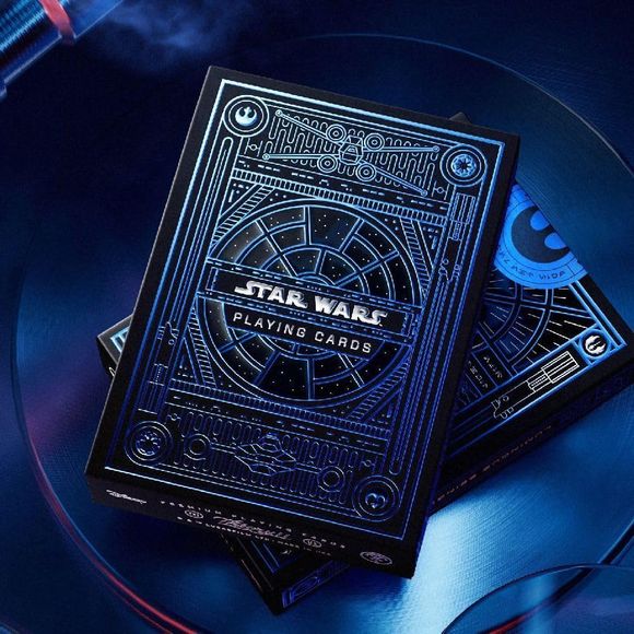 EMBOSSED AND FOIL STAMPED. The outer packaging features blue foil and reflective clear foil detailing, creating a window-like design effect inspired by the Millennium Falcon. The deck includes themed design elements based on the Star Wars universe.
ALL CUSTOM COURT CARDS. Each deck has a set of 12 court cards, with iconic Light Side characters. Each card features detailed depictions of these iconic heroes: Luke Skywalker, Obi-Wan Kenobi, Rey, Leia Organa, Han Solo, and more!
LOADED WITH DETAILS. Across the