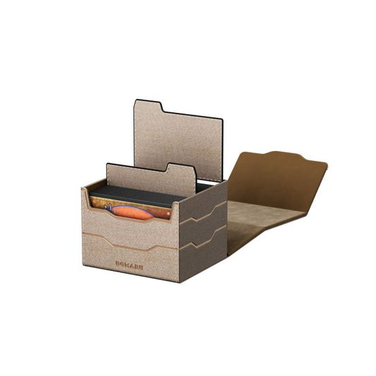 The DOMARU Armory Collection is our latest deck box line, built for strength, durability, and a commanding presence at the table. Featuring refined metallic details, a rugged textured exterior, and strong magnetic closures, each Armory box delivers uncompromising protection for serious play. Side Loading. Fits 100 double-sleeved cards. Includes 2 leather dividers. Strong Magnets. Sturdy textured leather materials and metallic details.