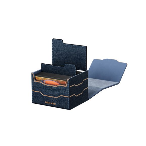 The DOMARU Armory Collection is our latest deck box line, built for strength, durability, and a commanding presence at the table. Featuring refined metallic details, a rugged textured exterior, and strong magnetic closures, each Armory box delivers uncompromising protection for serious play. Side Loading. Fits 100 double-sleeved cards. Includes 2 leather dividers. Strong Magnets. Sturdy textured leather materials and metallic details.