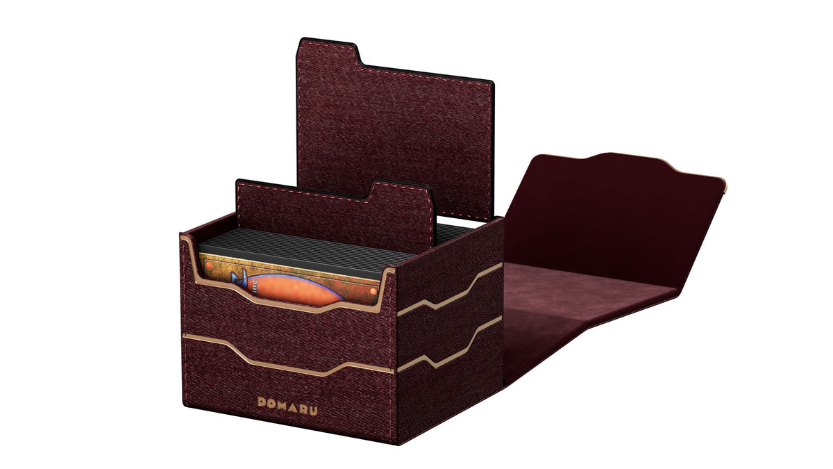 The DOMARU Armory Collection is our latest deck box line, built for strength, durability, and a commanding presence at the table. Featuring refined metallic details, a rugged textured exterior, and strong magnetic closures, each Armory box delivers uncompromising protection for serious play. Side Loading. Fits 100 double-sleeved cards. Includes 2 leather dividers. Strong Magnets. Sturdy textured leather materials and metallic details.
