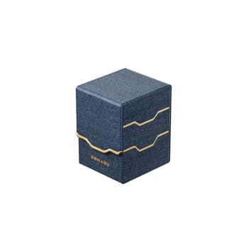 The DOMARU Armory Collection is our latest deck box line, built for strength, durability, and a commanding presence at the table. Featuring refined metallic details, a rugged textured exterior, and strong magnetic closures, each Armory box delivers uncompromising protection for serious play. Top Loading. Fits 100 double-sleeved cards. Includes 2 leather dividers. Strong Magnets. Sturdy textured leather materials and metallic details.