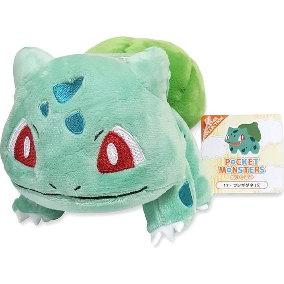 Bulbasaur is a small, quadruped Pokemon with green to bluish-green skin and darker green patches. It has red eyes with white pupils and sclera and pointed, ear-like structure on top of its head. Its snout is short and blunt, and it has a wide mouth. A pair of small, pointed teeth visible in the upper jaw when its mouth is open. Each of its thick legs ends with three sharp claws. On its back is a green plant bulb, which is grown from a seed planted there at birth. The bulb provides it with energy through pho